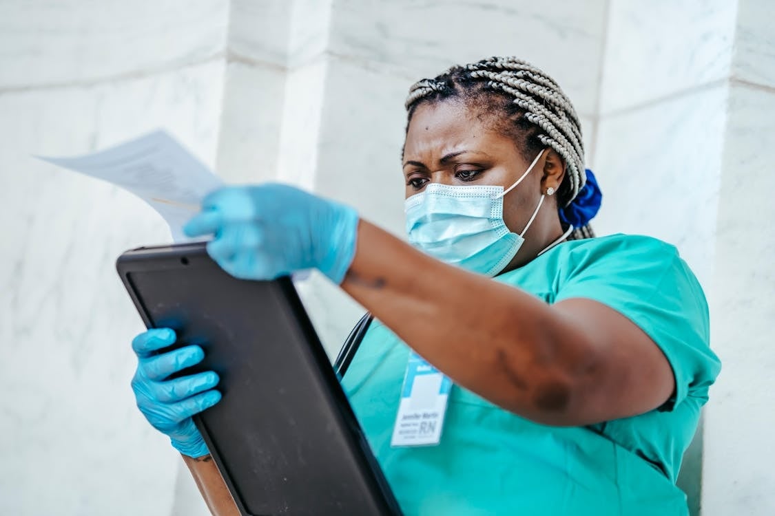 Compassionate nurse providing caring support to an elderly patient